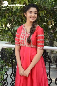 Actress Krithi Shetty in a red color salwar dress