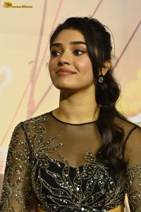 actress Krithi Shetty in a black dress at a function