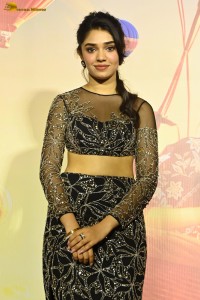 actress Krithi Shetty in a black dress at a function
