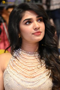 actress Krithi Shetty pretty in a white dress at a movie event