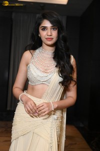 actress Krithi Shetty pretty in a white dress at a movie event