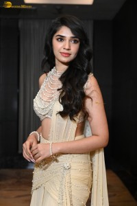 actress Krithi Shetty pretty in a white dress at a movie event