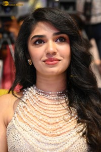 actress Krithi Shetty pretty in a white dress at a movie event