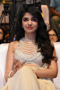 actress Krithi Shetty pretty in a white dress at a movie event