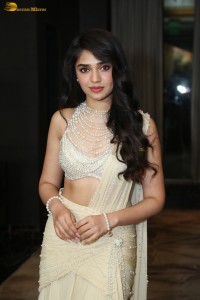 actress Krithi Shetty pretty in a white dress at a movie event