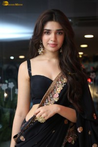 actress Krithi Shetty stunning in a black saree