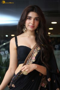 actress Krithi Shetty stunning in a black saree