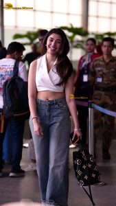 telugu actress Krithi Shetty cute in a white top and blue denim jeans