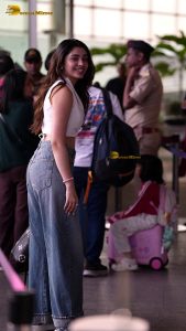 telugu actress Krithi Shetty cute in a white top and blue denim jeans