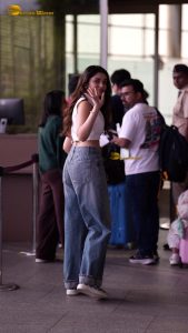 telugu actress Krithi Shetty cute in a white top and blue denim jeans