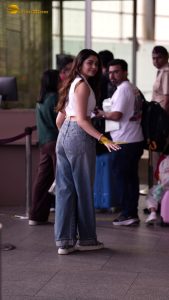 telugu actress Krithi Shetty cute in a white top and blue denim jeans