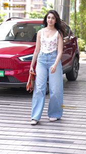 actress krithi shetty pretty in a white top and denim jeans