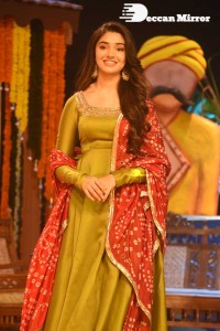 Actress Krithi Shetty dressed in a green Salwar Kameez dress while attending Bangarraju movie funciton