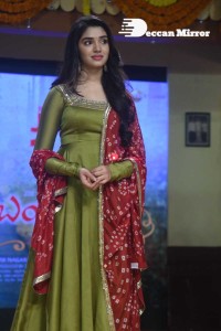 Actress Krithi Shetty dressed in a green Salwar Kameez dress while attending Bangarraju movie funciton