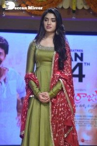 Actress Krithi Shetty dressed in a green Salwar Kameez dress while attending Bangarraju movie funciton