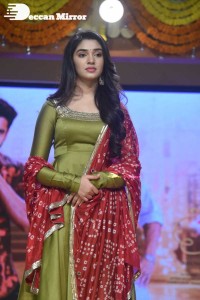 Actress Krithi Shetty dressed in a green Salwar Kameez dress while attending Bangarraju movie funciton