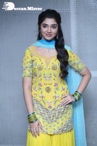 Actress Krithi Shetty in a Yellow Dress