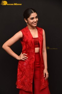 Actress Krithi Shetty in a red dress