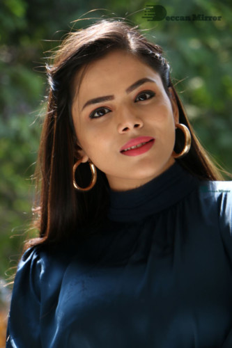 Telugu Actress Kriti Garg photoshoot in a dark green dress