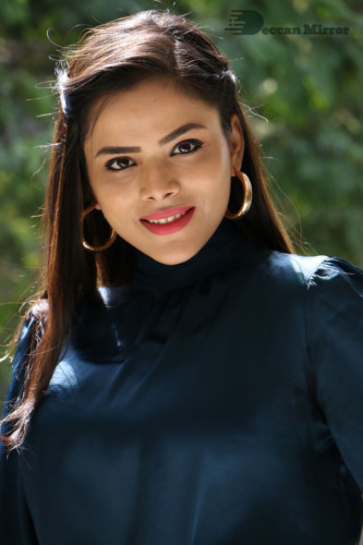 Telugu Actress Kriti Garg photoshoot in a dark green dress