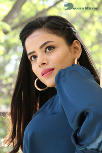 Telugu Actress Kriti Garg photoshoot in a dark green dress