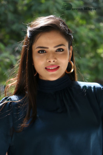 Telugu Actress Kriti Garg photoshoot in a dark green dress