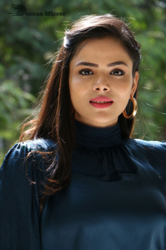 Telugu Actress Kriti Garg photoshoot in a dark green dress