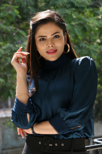 Telugu Actress Kriti Garg photoshoot in a dark green dress