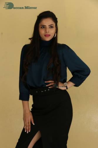 Telugu Actress Kriti Garg photoshoot in a dark green dress