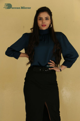 Telugu Actress Kriti Garg photoshoot in a dark green dress