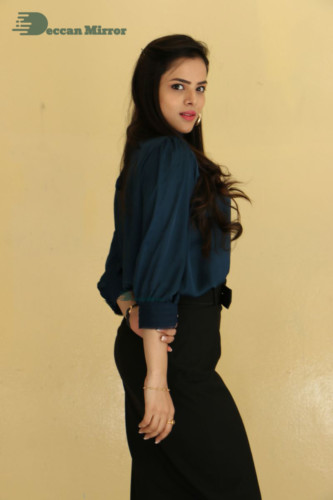 Telugu Actress Kriti Garg photoshoot in a dark green dress