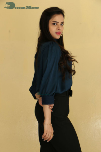 Telugu Actress Kriti Garg photoshoot in a dark green dress