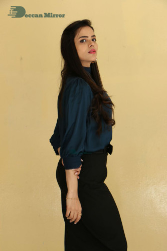 Telugu Actress Kriti Garg photoshoot in a dark green dress