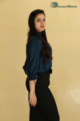 Telugu Actress Kriti Garg photoshoot in a dark green dress