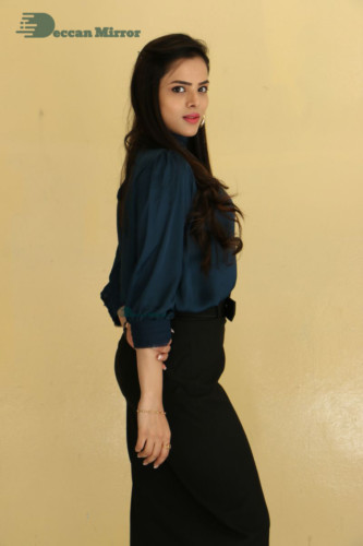 Telugu Actress Kriti Garg photoshoot in a dark green dress