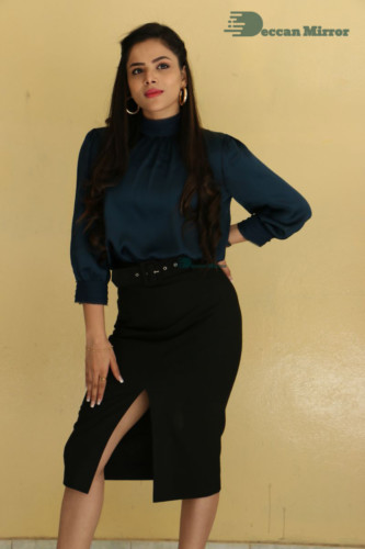 Telugu Actress Kriti Garg photoshoot in a dark green dress