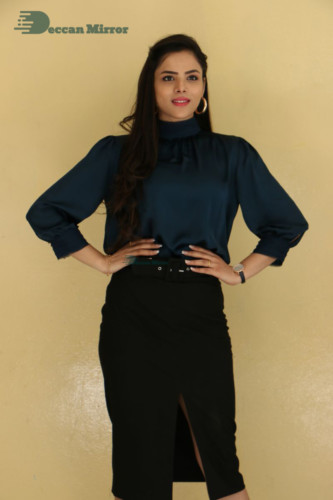 Telugu Actress Kriti Garg photoshoot in a dark green dress