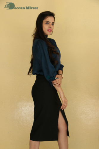 Telugu Actress Kriti Garg photoshoot in a dark green dress