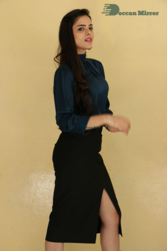 Telugu Actress Kriti Garg photoshoot in a dark green dress