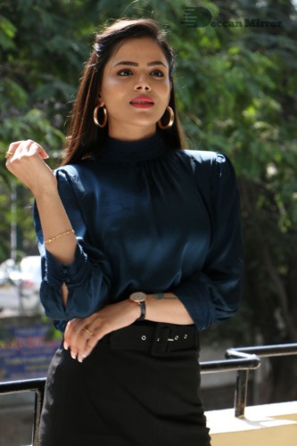 Telugu Actress Kriti Garg photoshoot in a dark green dress