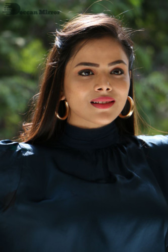 Telugu Actress Kriti Garg photoshoot in a dark green dress