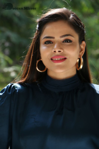 Telugu Actress Kriti Garg photoshoot in a dark green dress