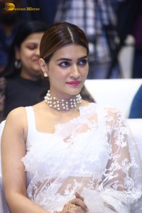 Indian Actress Kriti Sanon in a white saree while attending a movie function