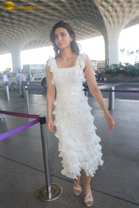 Indian actress Kriti Sanon in a white dress at mumbai airport