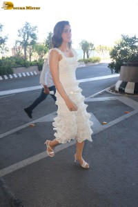 Indian actress Kriti Sanon in a white dress at mumbai airport