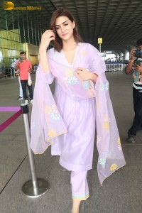 Actress kriti sanon in a pink salwar suit at mumbai airport