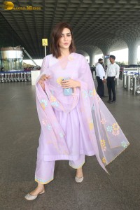 Actress kriti sanon in a pink salwar suit at mumbai airport
