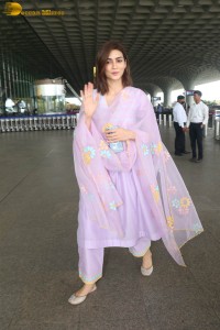 Actress kriti sanon in a pink salwar suit at mumbai airport