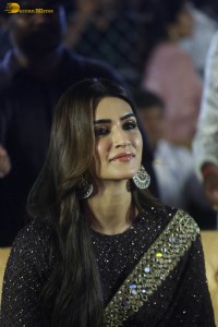 indian actress kriti sanon in a shiny black saree at a movie event