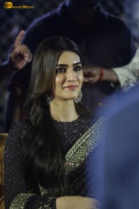 indian actress kriti sanon in a shiny black saree at a movie event